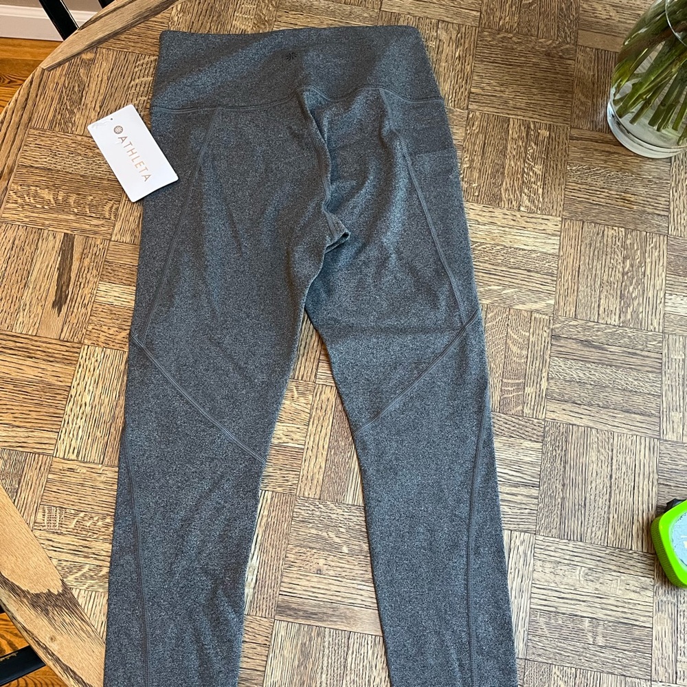Athleta stash pocket salutation tights